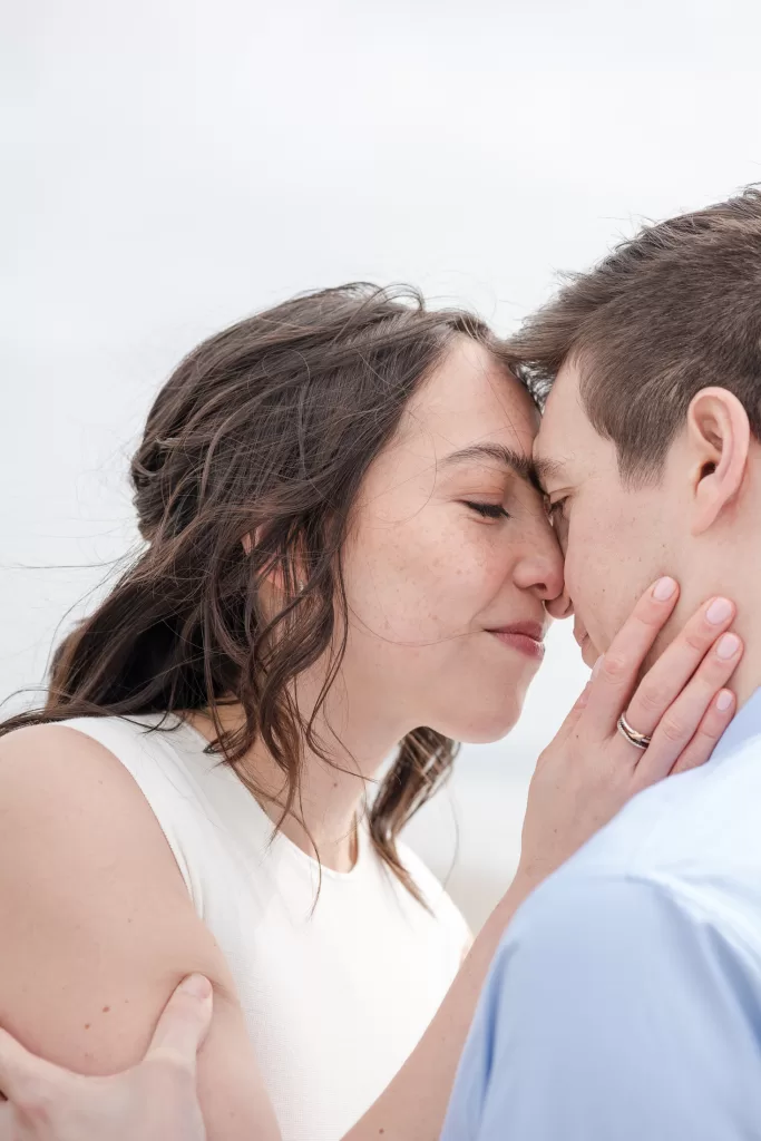 couple during san diego engagement photo session white dress and blue button-down with navy pants