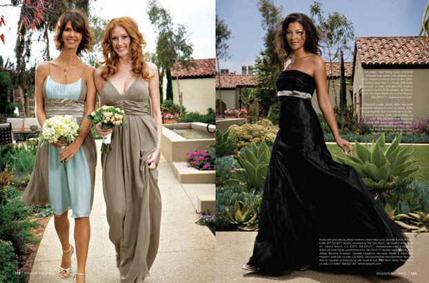 Three women in formal dresses pose outdoors in a garden setting, perfect for Exquisite Weddings Magazine. Two walk side by side with bouquets, while the third showcases her long black gown amid lush greenery and buildings.